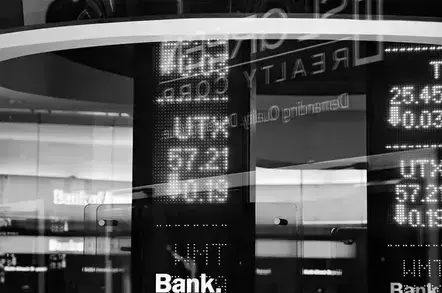 stock ticker visible on a futuristic billboard
